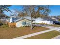 Aerial view of a charming single-story home featuring a well-maintained lawn and a convenient circular driveway at 10906 Covey Ct, Tampa, FL 33625