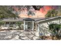Charming single-story home with a well-maintained lawn and mature trees at 1118 Monterey Ne Blvd, St Petersburg, FL 33704