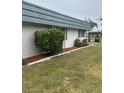 Lush green yard with attractive shrubbery and mulch landscaping at 1811 Bedford Ln # 162, Sun City Center, FL 33573