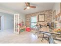 Bright and airy office space featuring large windows, unique accent wall and modern flooring at 4810 Centerbrook Ct, Tampa, FL 33624