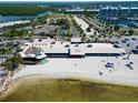 An aerial view of beachside restaurant offering dining with beach access and panoramic waterfront views at 611 Destiny Dr # 604, Ruskin, FL 33570