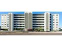 Multi-story building featuring private balconies and well-maintained landscaping at 7321 Central Ave # 402, St Petersburg, FL 33710