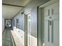 Exterior hallway view showcasing unit doors and outdoor lighting at 7321 Central Ave # 402, St Petersburg, FL 33710