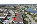 An aerial view showcases the home's location near a pond and within a well-planned community at 4375 Barletta Ct, Wesley Chapel, FL 33543