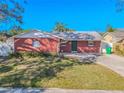 Charming single-story brick home with well-maintained lawn and inviting front entrance at 6961 Dalkeith N Ave, St Petersburg, FL 33709