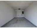 Spacious carport featuring a concrete floor and access door at 10116 Tulip N St # 10116, Pinellas Park, FL 33782