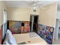Bright bedroom featuring a ceiling fan and unique wall art, ready for personalization at 2656 44Th S St, Gulfport, FL 33711