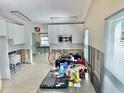Spacious kitchen with white cabinets and stainless steel appliances; awaiting your personal touches at 2656 44Th S St, Gulfport, FL 33711