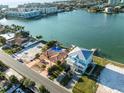 An aerial view shows a beautiful waterfront home in a coastal neighborhood at 329 55Th Ave, St Pete Beach, FL 33706