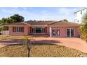 Exterior view of single Gathering house with a beautiful front yard and driveway at 329 55Th Ave, St Pete Beach, FL 33706