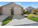 The large driveway and well-manicured front yard add curb appeal to this cozy home at 6428 Thicket Trl, New Port Richey, FL 34653