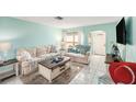 Bright and airy living room with comfortable seating and decor for a relaxing atmosphere at 8341 Moulton Dr, Port Richey, FL 34668