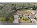 Charming single-story home featuring well-maintained landscaping and attached two-car garage at 988 Villeroy Greens Dr, Sun City Center, FL 33573