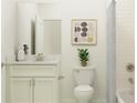 Stylish bathroom features a shower, a framed art piece, and a vanity with marble countertop and a round vessel sink at 11870 Sparkling Topaz Cv, Parrish, FL 34219