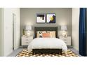 Inviting bedroom showcases stylish decor, a cozy bed with stylish pillows and a patterned rug at 11870 Sparkling Topaz Cv, Parrish, FL 34219
