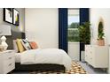 Inviting bedroom showcases stylish decor, a cozy bed with stylish pillows and a patterned rug at 11870 Sparkling Topaz Cv, Parrish, FL 34219