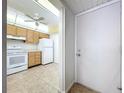 An eat-in kitchen with a white door that leads outside at 11945 143Rd St # 7122, Largo, FL 33774