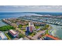 Wide aerial view of waterfront community with canals, private docks, and surrounding cityscape at 19029 Us Highway 19 N # 35E, Clearwater, FL 33764