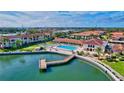 Aerial view of a community pool and waterfront clubhouse for luxury waterfront condos at 19029 Us Highway 19 N # 35E, Clearwater, FL 33764