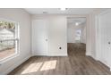 Bright, open living space with wood-look floors and neutral walls at 1931 24Th S St, St Petersburg, FL 33712