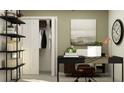 Well-lit office with a minimalist desk, shelving, decor and a view of the closet at 9452 Runaway Breeze Dr, Land O Lakes, FL 34637