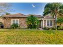 Charming home with stone accents, well-manicured lawn and beautiful landscaping at 10534 Bermuda Isle Dr, Tampa, FL 33647