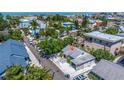 Aerial view of a lovely property nestled in a cozy neighborhood, close to local streets and residential areas at 136 93Rd Ave, Treasure Island, FL 33706
