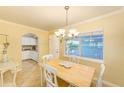 Cozy dining room featuring a wooden table with seating for four and natural light at 19417 Gulf Blvd # D-206, Indian Shores, FL 33785