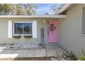 Close-up of front door, with wreath and welcome sign at 245 Faithway Dr, Seffner, FL 33584