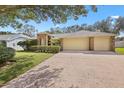 Well-maintained home with a spacious driveway leading to a two-car garage at 3917 Appletree Dr, Valrico, FL 33594
