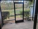 Screened-in patio offering views of the private backyard and lush greenery at 5100 Burchette Rd # 2103, Tampa, FL 33647
