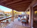 Spacious waterfront balcony featuring comfortable seating, scenic views and string lights for a cozy atmosphere at 6291 Sebring St, Weeki Wachee, FL 34607