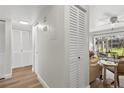 Bright condo hallway leading to a sunlit living area, featuring multiple closets for ample storage space at 3824 37Th S St # 65, St Petersburg, FL 33711