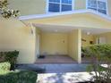 A charming, covered porch area, perfect for relaxing outdoors, with a neutral color scheme at 415 Bayou Village Dr, Tarpon Springs, FL 34689