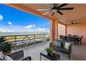 Relaxing outdoor balcony with comfortable seating and dining furniture overlooking the tranquil bay waters at 4951 Bacopa S Ln # 103, St Petersburg, FL 33715