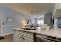 Open floor plan with a view from the kitchen of the dining and living spaces at 10764 70Th Ave # 2110, Seminole, FL 33772
