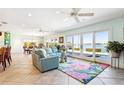 Bright living room features a waterfront view, tile flooring and lots of light at 11385 9Th E St, Treasure Island, FL 33706