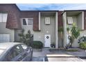 Well-maintained townhome with a welcoming facade and front door adorned with a wreath at 1370 70Th N St # 2-1382, St Petersburg, FL 33710