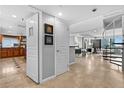 Hallway view of the modern kitchen, spiral staircase and an open-concept floor plan at 201 W Laurel St # 1006, Tampa, FL 33602