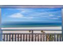 Enjoy the stunning beach view from this condo balcony, perfect for relaxation at 555 Gulf Way # 7N, St Pete Beach, FL 33706