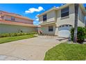 Charming two-story home features a clean design and a one car garage at 6109 Mirada Cir, St Petersburg, FL 33715