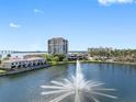 Beautiful waterfront condominiums surround a fountain lake with lush landscaping and palm trees at 6287 Bahia Del Mar Cir # 606, St Petersburg, FL 33715