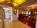 Cozy living room and dining area featuring hardwood floors, ceiling fan, and an open layout at 7040 Cognac Dr # 1, New Port Richey, FL 34653