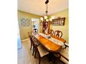 Charming dining room with a chandelier and seating for six at 1656 S Lake Ave # 3, Clearwater, FL 33756