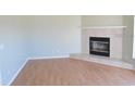 Bright living room featuring hardwood floors and fireplace at 1814 Wood Trail St, Tarpon Springs, FL 34689