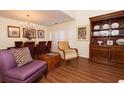 Elegant dining area featuring a chandelier and a dining table for six at 18934 Avenue Biarritz, Lutz, FL 33558