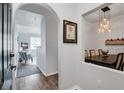 Comfortable living room view into dining area with modern lighting and open concept design at 501 Knights Run Ave # 1203, Tampa, FL 33602