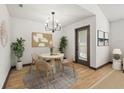 Cozy dining area features a round table, modern chandelier, and stylish decor for comfortable everyday meals at 11901 4Th N St # 7307, St Petersburg, FL 33716