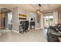 Comfortable living room boasts natural light and smooth flooring, flowing into the outdoor living space at 2619 Ravendale Ln, Holiday, FL 34691