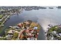 Scenic aerial view of a waterfront home with a red outline, showcasing its prime location on the bay at 4811 Paradise S Way, St Petersburg, FL 33705